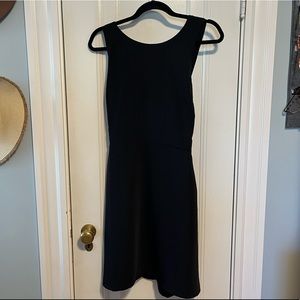 Cross back sleeveless little black dress